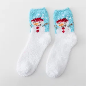 Close-up details of soft fuzzy winter plush socks featuring cute snowman pattern for cozy wear.