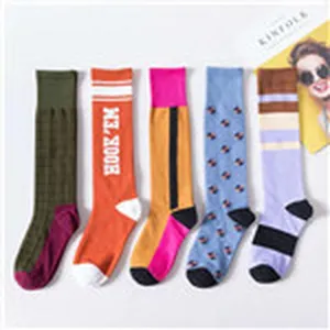 Korean style long socks for women, fashionable high tube knee high stockings with cute designs.