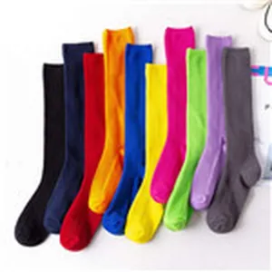 Solid color knee high socks for women, stretchy long cotton socks in multiple vibrant colors.
