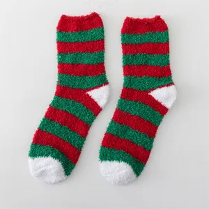 Cozy winter fluffy striped socks with red and green colors and soft plush microfiber fabric.