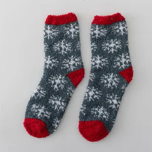 Winter fluffy fuzzy socks with snowflake pattern and red cuffs, cozy thick thermal socks.