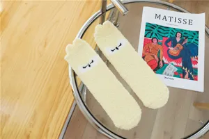 Cute fluffy yellow fleece sleeping socks, ultra soft microfiber winter home slippers for women.