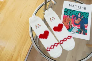 Women winter fuzzy coral fleece slipper socks with cute cat face and red heart design.
