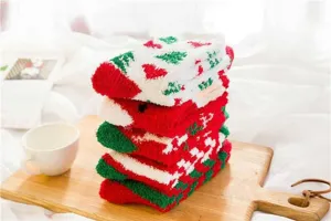 Christmas fluffy fuzzy socks detail view, cozy coral fleece material, warm winter home wear.
