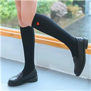 Black knee-high socks with cute red heart embroidery, stylish women long tube hosiery.