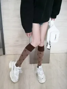 Japanese JK uniform brown knee-high socks with stylish monogram pattern for daily wear.