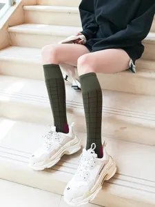 Dark green grid knee high socks for women Japanese JK style cotton long tube socks detail view.