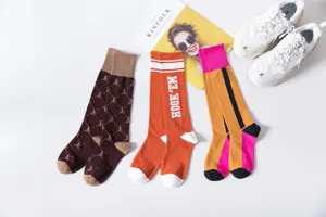 Trendy women long cotton high socks featuring fashionable patterns and cozy daily wear styles.
