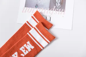 Orange collegiate striped knee high socks for women, fashionable cotton casual wear daily style.