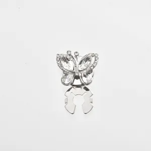 Exquisite rhinestone butterfly scarf buckle detail shot, sparkling crystal apparel accessory.