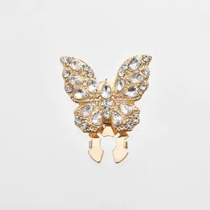 Exquisite rhinestone butterfly clip detail shot, sparkling crystal fashion accessory.