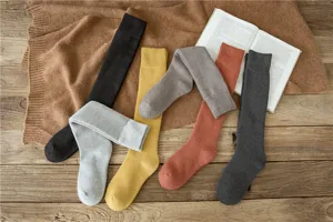 Thickened warm winter long socks for women, cozy cotton knit knee high socks detail view.