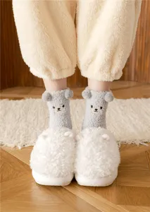 Grey plush socks with cute 3D bear ears and embroidered face detail, cozy home indoor wear.