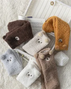 Fuzzy plush bear socks detail view, fluffy coral fleece warm winter sleep socks with 3D ears.