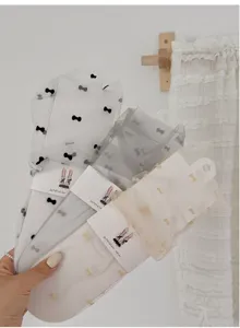 Sheer mesh bow print mid-calf socks for women, breathable summer cute thin hosiery detail.