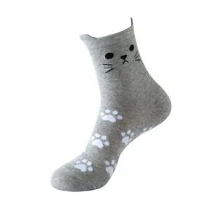 Grey cat cotton sock detail, featuring cat ear cuff, black face and white paw prints.