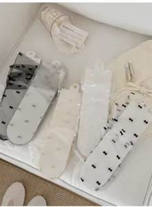 Sheer mesh bow socks for women, breathable summer vintage style crew socks with cute flocking dots.