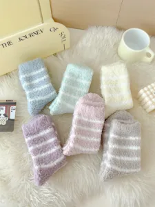 Cozy thick striped coral fleece sleep socks detail shot, soft plush warm home winter wear.