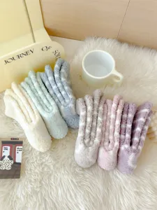 Plush fuzzy coral fleece striped sleep socks detail shot, ultra soft and warm for winter.