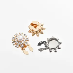 Detail view of rhinestone sunflower shirt buttons, electroplated alloy decorative cufflinks.