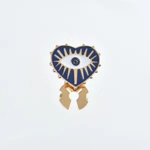 Evil eye retro shirt clip detail shot, elegant gold alloy collar decorative accessory.
