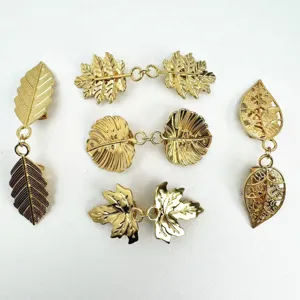 Gold-plated leaf clothing clips, elegant metal scarf fasteners and delicate cardigan clips.