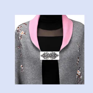 Grey knitted shawl with pink collar floral embroidery and elegant silver metal sweater clip.