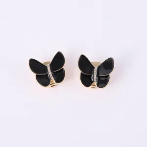 Détail de boutons de manchette papillon noir 3D strass exquis, accessoire élégant mode.