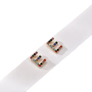 Chic gold-plated letter E stud earrings sparkling with colorful rhinestone crystal accents.