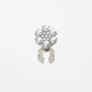Close-up of the elegant pearl collar clip showing intricate floral pearl cluster and sturdy metal clip.