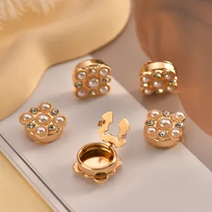 Exquisite pearl rhinestone decorative buttons, collar clips, shiny gold metal clasp detail shot.