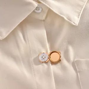 Exquisite gold decorative shirt buckle, elegant neckline accessory for stylish women's clothing.