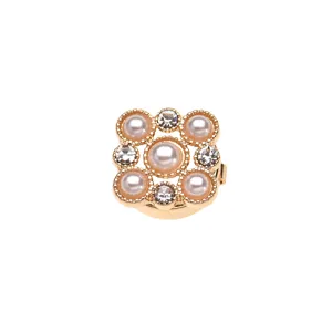 Pearl rhinestone shirt collar button detail, elegant gold decorative cufflink for women.