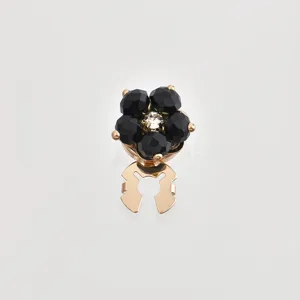 Detailed shot of the vintage black crystal flower decorative button, exquisite alloy craftsmanship.