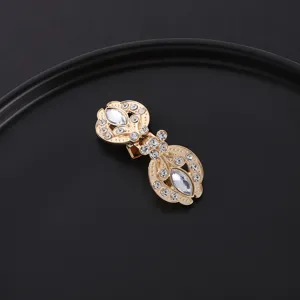 Vintage rhinestone collar clip and scarf buckle with golden carved metal and clear stones.