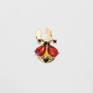 Exquisite crystal beetle collar pin detail view, premium gold-toned metal fashion accessory.