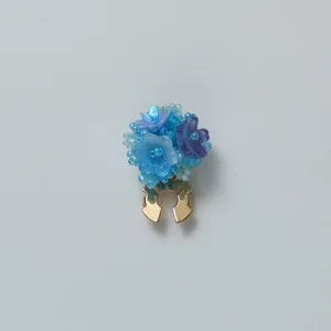 Blue resin flower scarf clip detail shot, elegant decorative brooch for women daily wear.