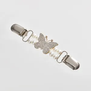 Exquisite pearl rhinestone butterfly sweater clip detail, elegant clothing accessory for cardigan collar.