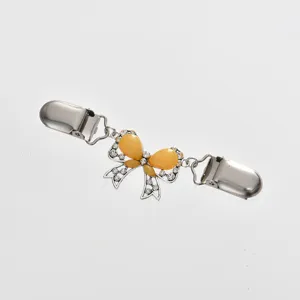 Exquisite metal sweater clip with yellow bow and clear rhinestones for collar and scarf decoration.