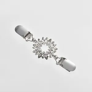 Rhinestone sweater clip detail view, sparkling crystal flower shawl clip for women.