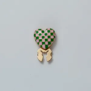 Detailed close-up view of a chic pink green checkerboard heart scarf ring and shirt clip.