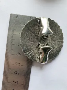 Vintage alloy shawl clip back view detail, round floral scarf buckle sizing display with ruler.