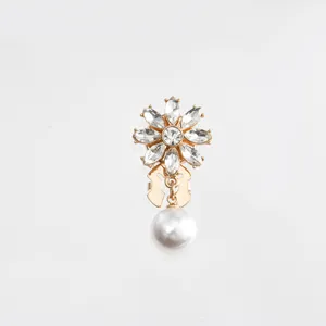 Crystal flower pearl pendant clothing accessory detail closeup view button pin decor
