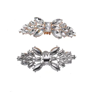 Close-up detail shot of sparkling crystal rhinestone butterfly shoe clips with alloy base.