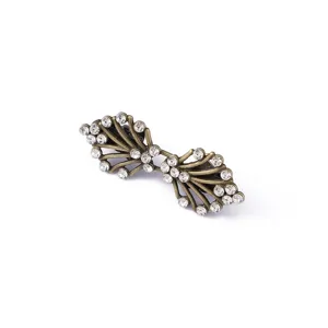 Close-up detail of vintage bronze tone rhinestone scarf clip collar accessory sparkle elegance.