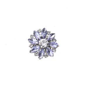 Detailed view of luxury floral rhinestone metal decorative button for shirt suit sweater.