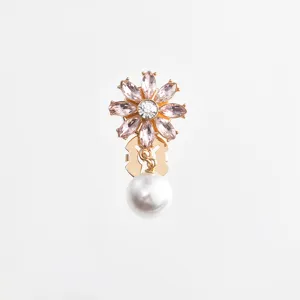 Crystal flower pearl collar pin detail shot, elegant gold tone decorative button for shirt.