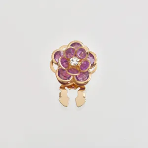 Close-up detail of the translucent purple crystal flower scarf buckle, gold metal frame.