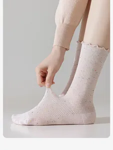 Close-up of women's summer thin nep yarn crew socks with breathable mesh and cute ruffled top.
