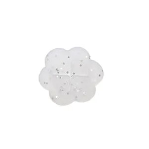 Flower shape clothing cinch clip detail, transparent glitter shirt fastener accessory.
